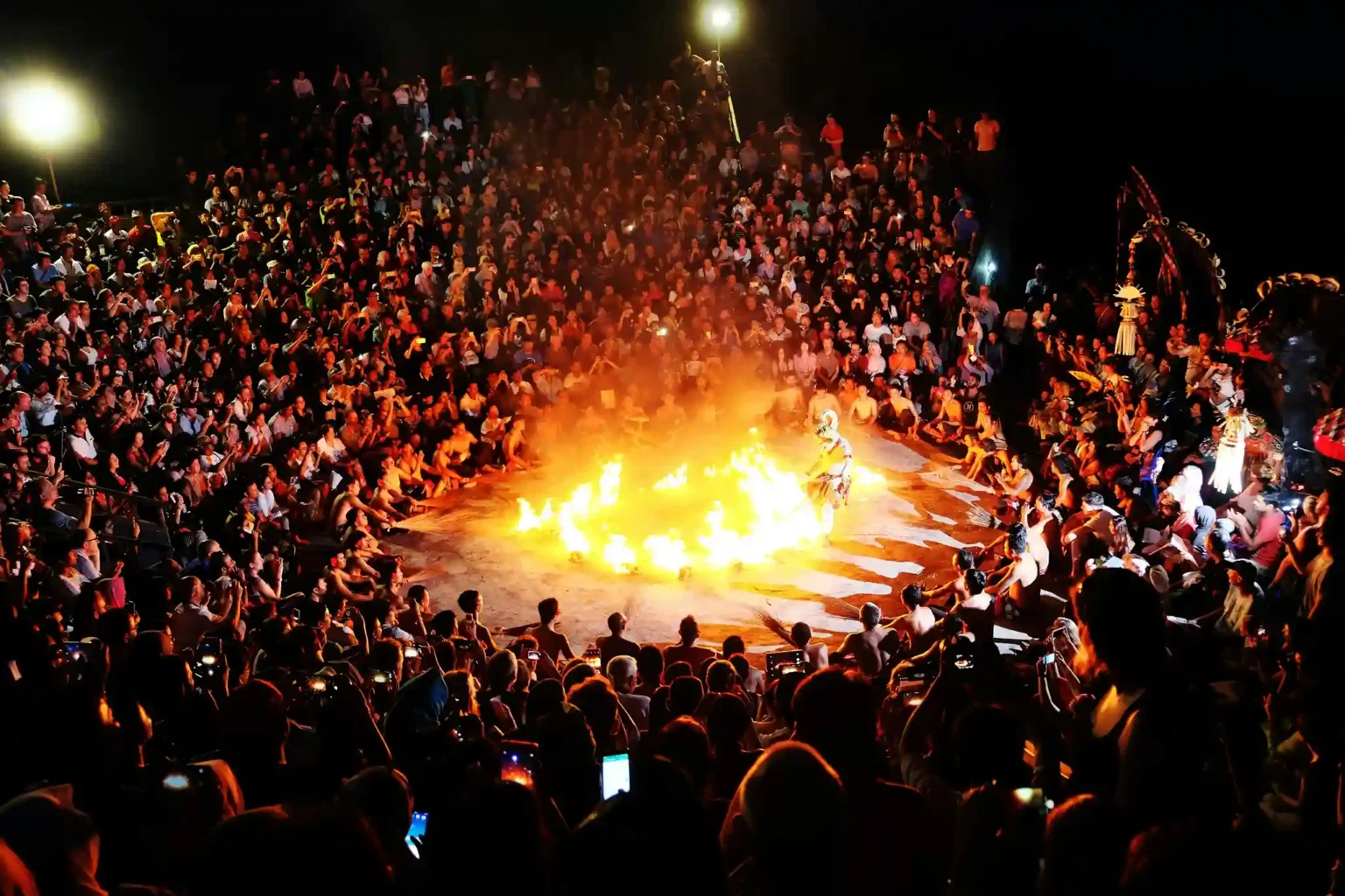 Performers on stage in Bali at dusk
